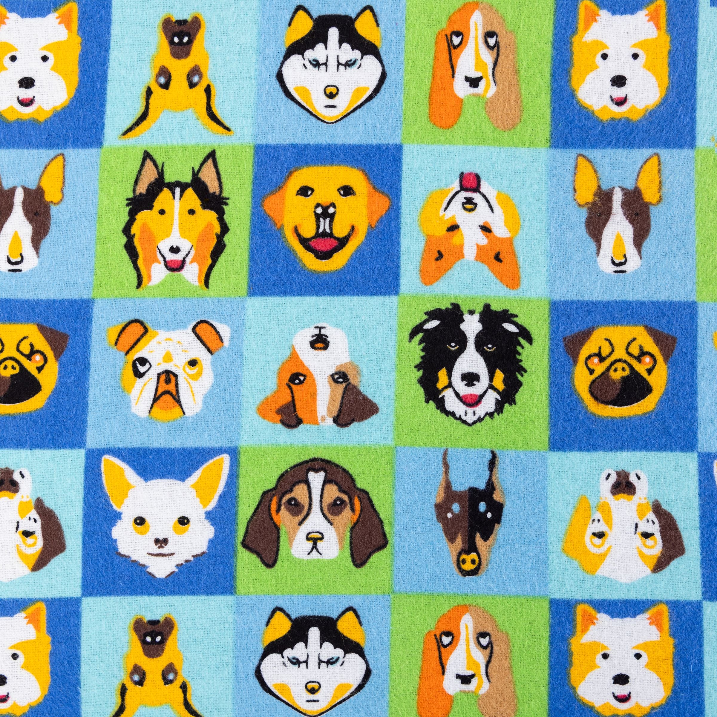 Close up of a Blue Toby Cotton Flannel blanket pattern of dog faces in various colors on a checkered blue and green background