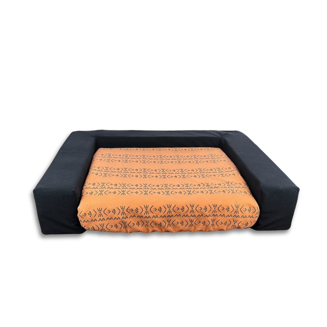 Blue Toby bolster in black with Slipcover in My Tribe orange